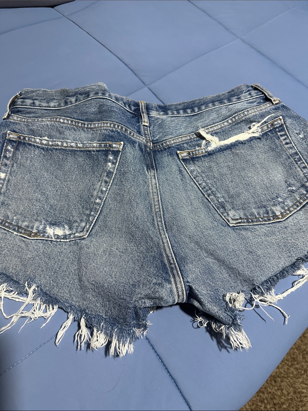 Agolde Distressed Mid-Blue Denim Cutoff Shorts - Picture 3 of 3